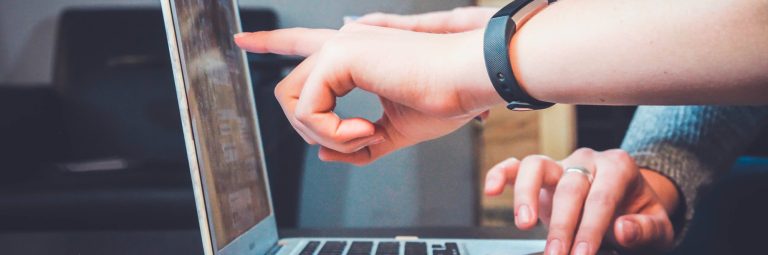 fingers pointing to a screen