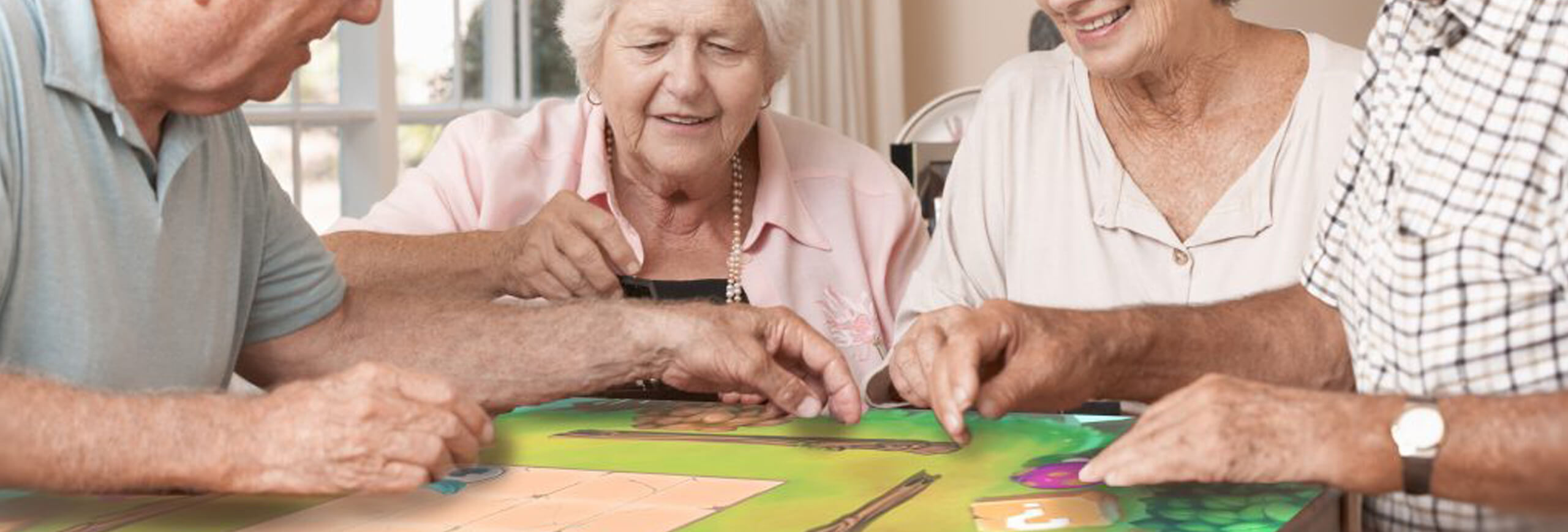 Seniors playing on tabletop