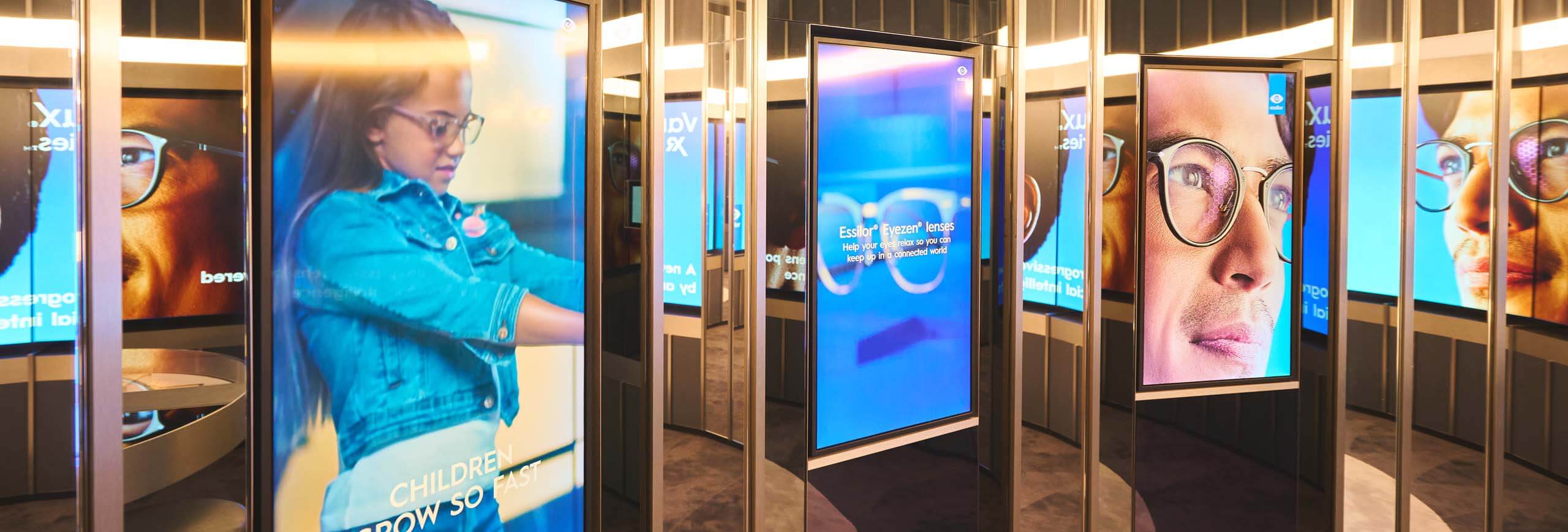 EssilorLuxottica multiple digital screens inside their store