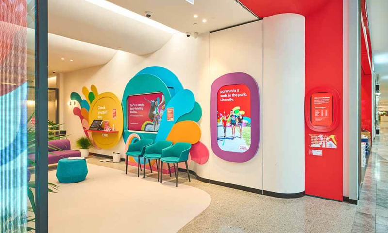 Medibank the Glen facade with digital screens and colourful interior space