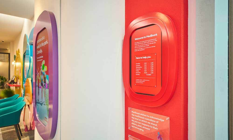 Close up shot of a small digital screen with store hours at Medibank the Glen