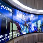 EssilorLuxottica curved LCD screens inside their store