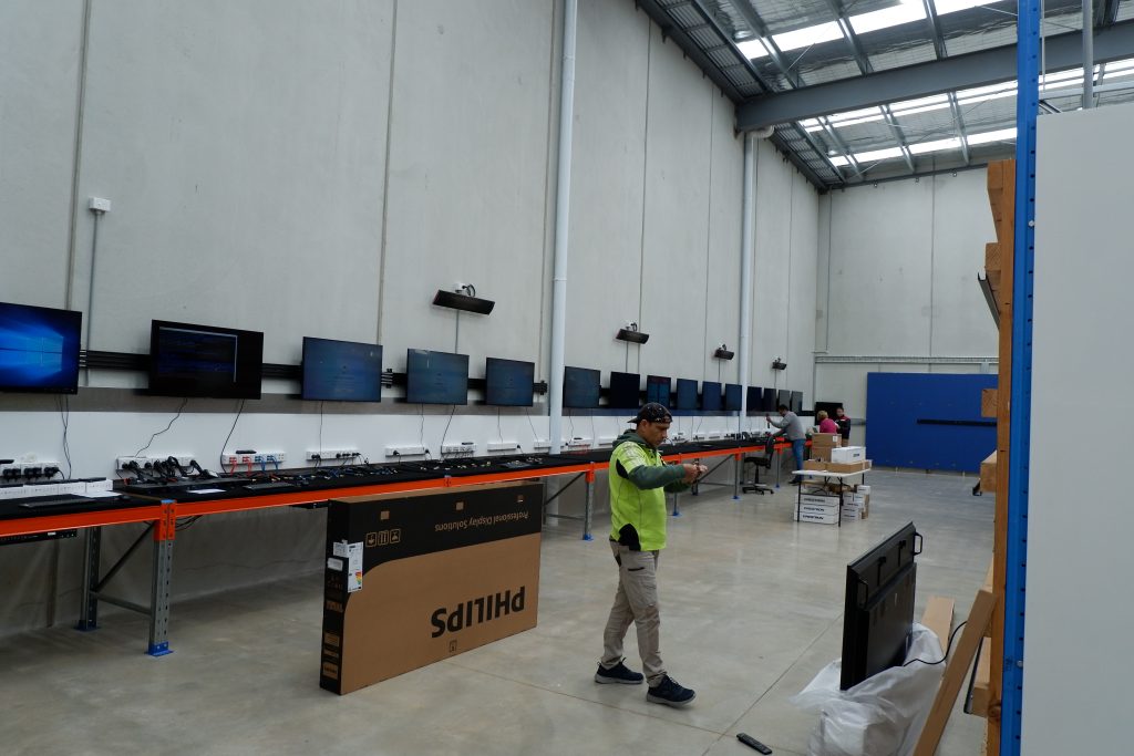 Engagis team staging and testing digital screens before a network rollout