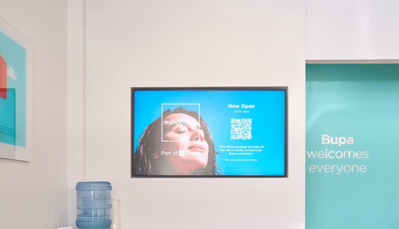 Lobby and Reception Displays (screen crop) Digital screen on the wall of a Bupa branch waiting area